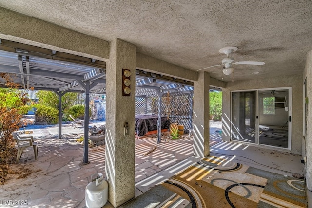 view of patio / terrace with a lanai and ceiling fan