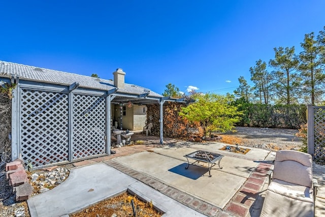 view of patio / terrace featuring a fire pit