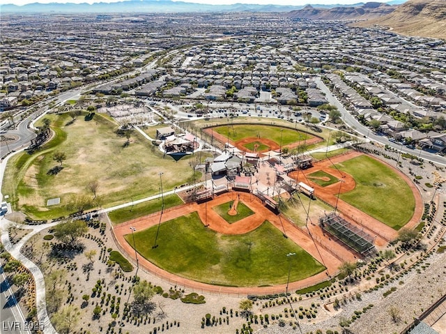 birds eye view of property with a mountain view