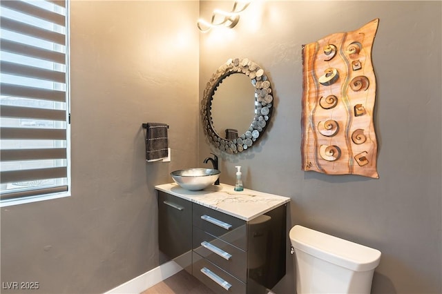 bathroom with vanity and toilet