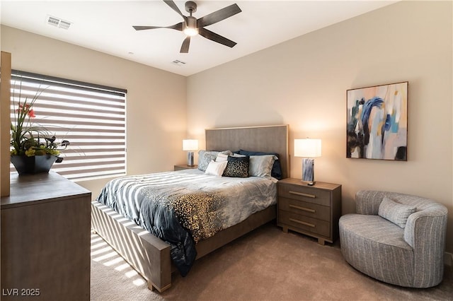 bedroom featuring ceiling fan and light colored carpet