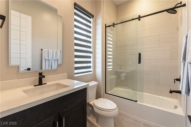 full bathroom with vanity, enclosed tub / shower combo, and toilet