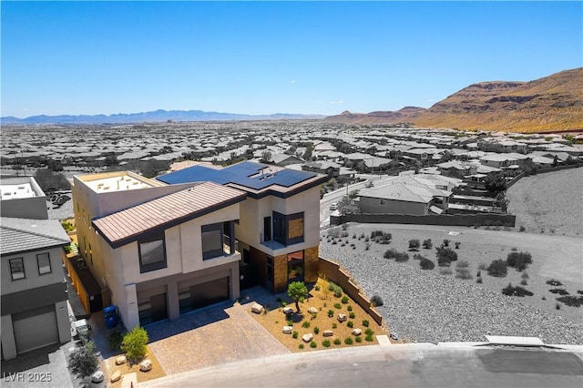 birds eye view of property with a mountain view