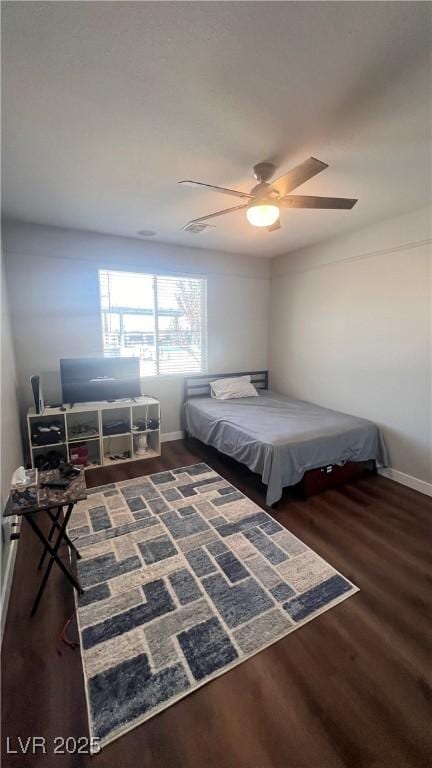 bedroom featuring dark hardwood / wood-style floors and ceiling fan