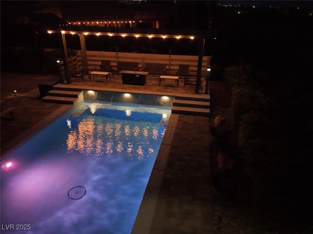 view of swimming pool with a patio area