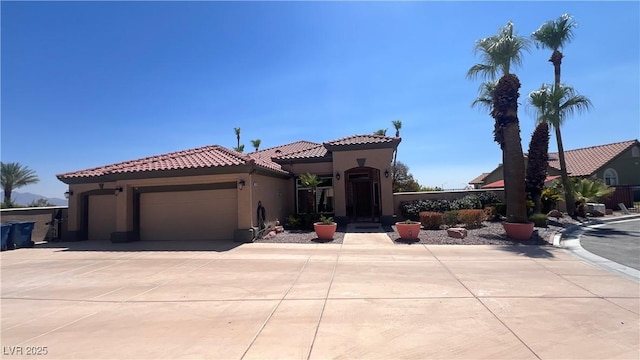 mediterranean / spanish-style house featuring a garage