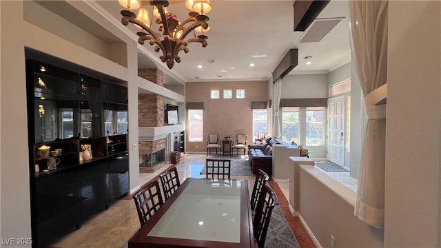 dining space with an inviting chandelier, crown molding, and a towering ceiling