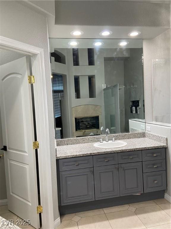 bathroom with tile patterned floors and vanity