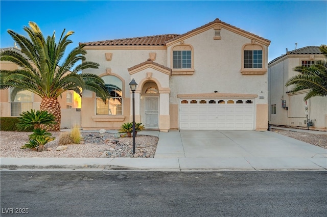 mediterranean / spanish-style house featuring a garage