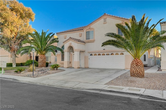 mediterranean / spanish-style home featuring a garage