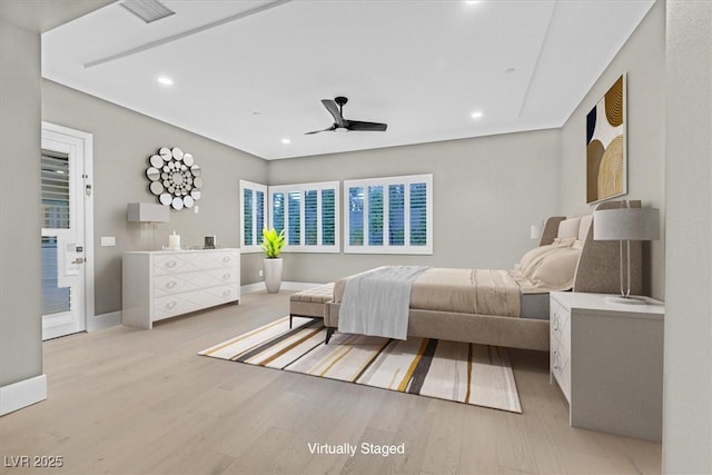 bedroom with recessed lighting, light wood-type flooring, and baseboards