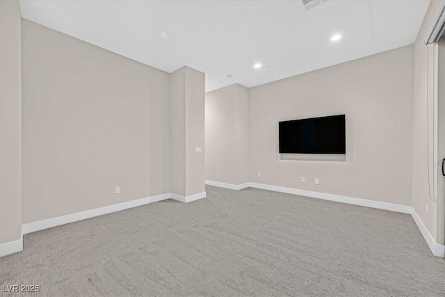 unfurnished living room featuring carpet floors, recessed lighting, and baseboards