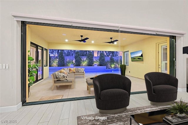 view of patio / terrace with ceiling fan and a wooden deck