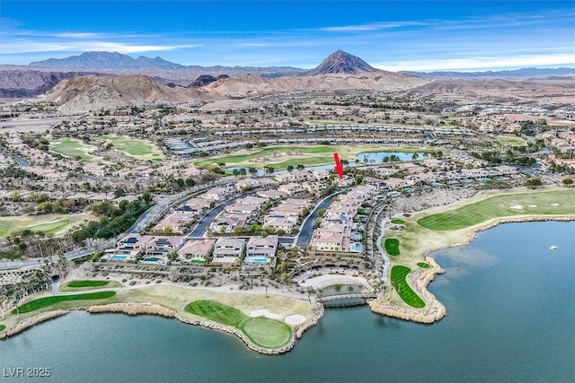 drone / aerial view featuring a water and mountain view