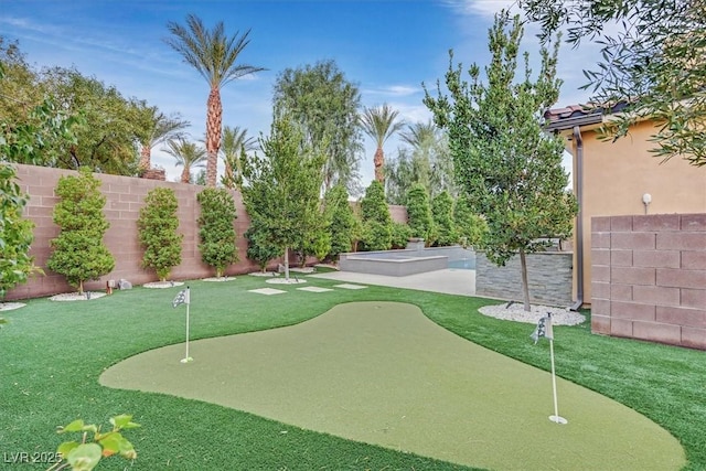 view of community with a fenced backyard