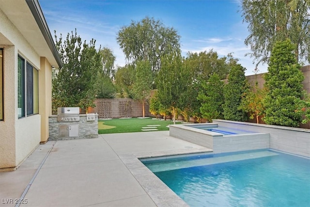 view of pool featuring a patio, an outdoor kitchen, a fenced backyard, area for grilling, and a fenced in pool