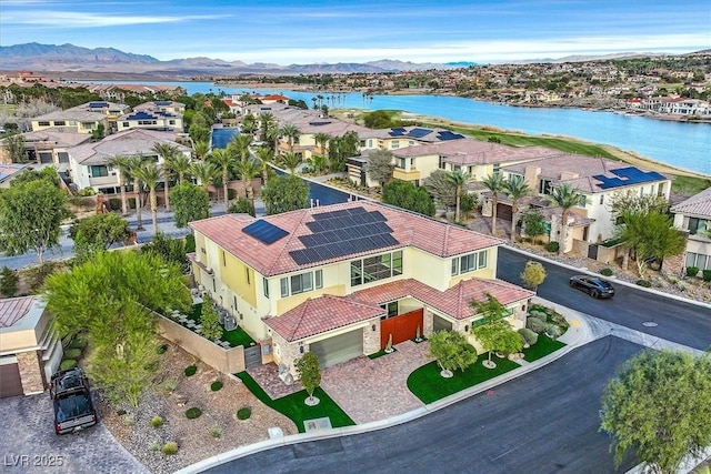 aerial view with a residential view and a water and mountain view