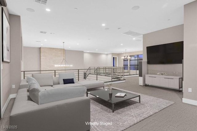 living room with carpet floors, recessed lighting, visible vents, and a notable chandelier