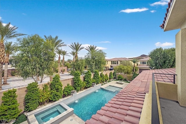 view of pool featuring a pool with connected hot tub