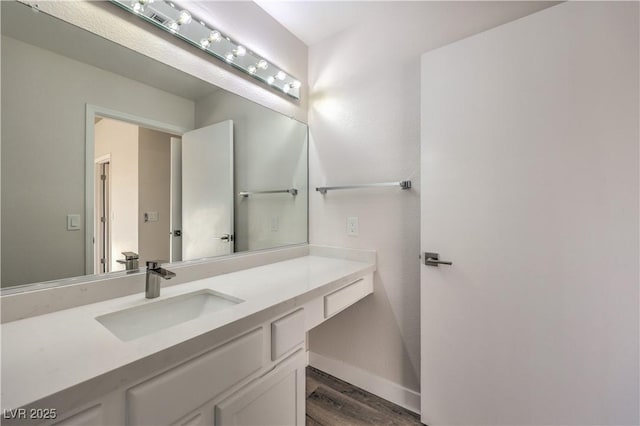 bathroom featuring hardwood / wood-style flooring and vanity