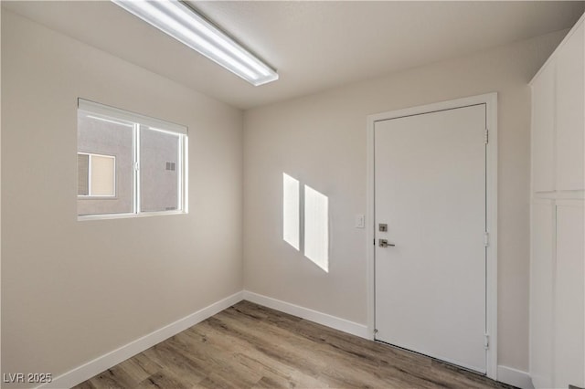 spare room with plenty of natural light and light wood-type flooring