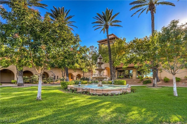 view of home's community featuring a lawn