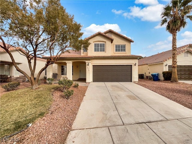 view of front of property featuring driveway, a porch, stucco siding, a garage, and a tile roof