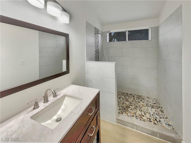 bathroom with vanity and a walk in shower