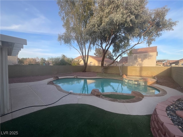 view of pool with a patio, a pool with connected hot tub, and a fenced backyard