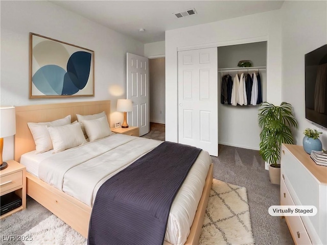 bedroom with visible vents, a closet, and carpet flooring