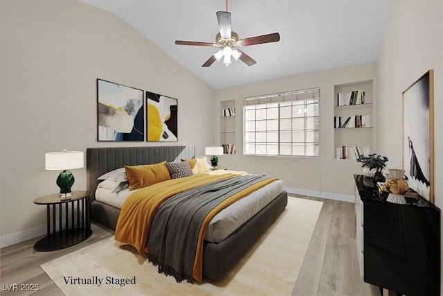 bedroom featuring vaulted ceiling, ceiling fan, and light hardwood / wood-style floors