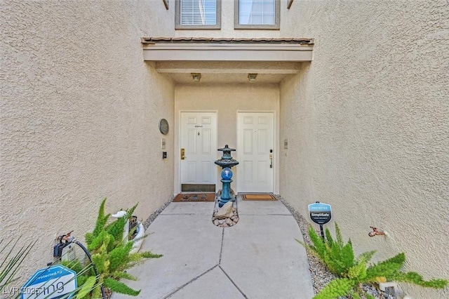 doorway to property featuring a patio area