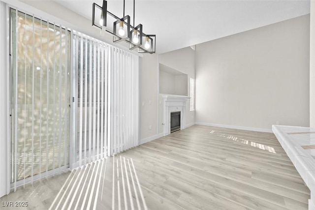 unfurnished living room with light wood-type flooring