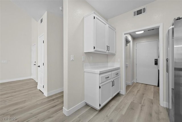 hallway featuring light hardwood / wood-style flooring