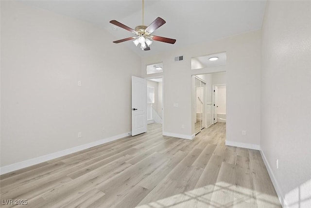 spare room with high vaulted ceiling, ceiling fan, and light wood-type flooring