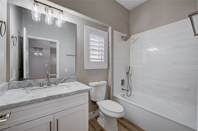 full bathroom with vanity, toilet, tub / shower combination, and wood-type flooring