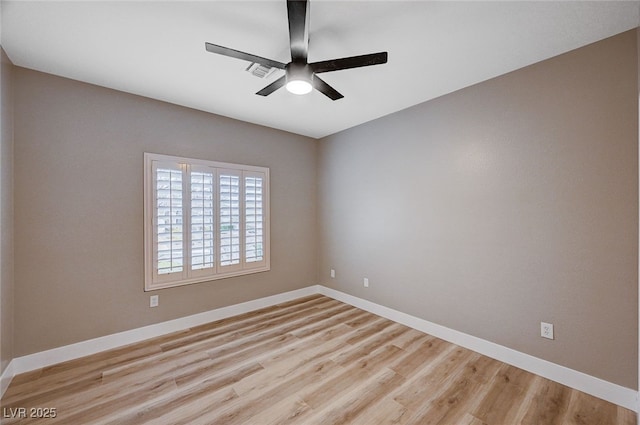 empty room with light hardwood / wood-style floors and ceiling fan