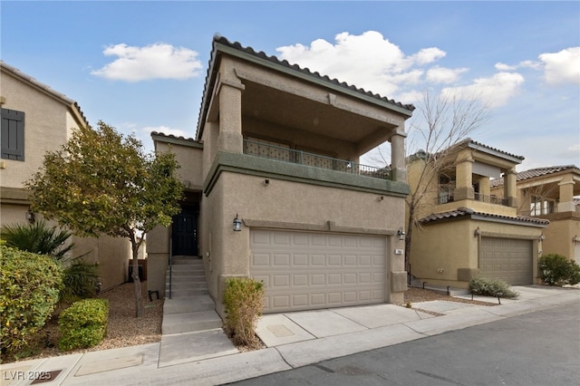 view of front of house featuring a balcony and a garage