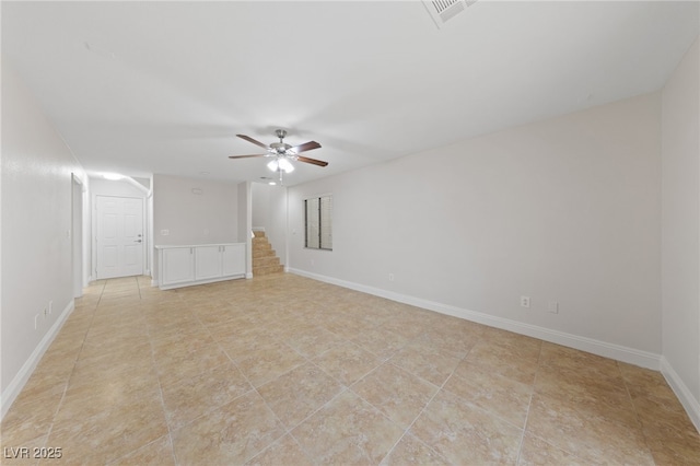 unfurnished room with ceiling fan