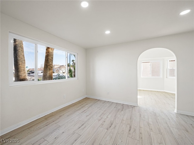 unfurnished room with light hardwood / wood-style flooring