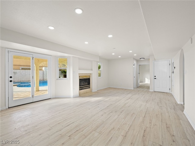 unfurnished living room featuring light hardwood / wood-style floors