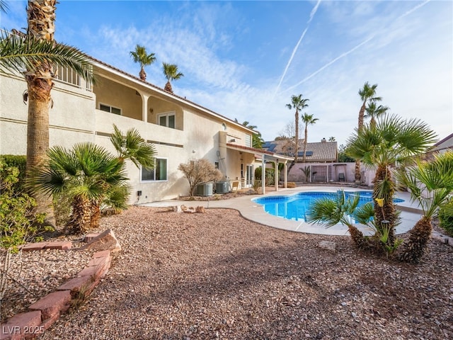 view of swimming pool with central AC and a patio area