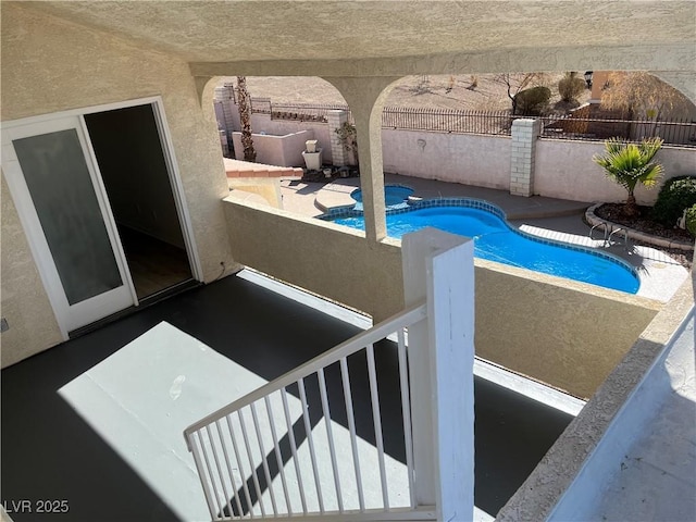 view of pool featuring an outdoor hot tub and a patio