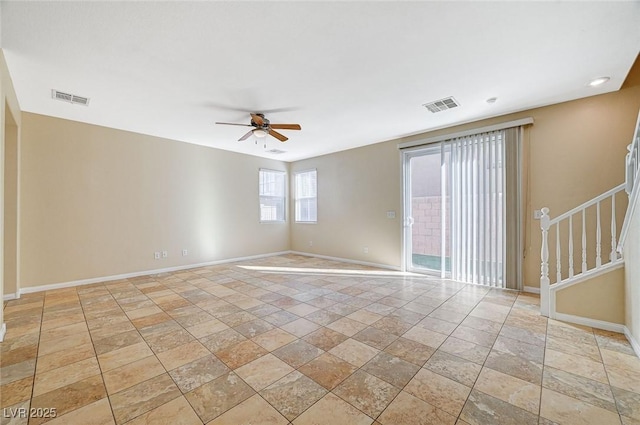 spare room with ceiling fan