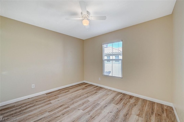 unfurnished room featuring ceiling fan and light wood-type flooring