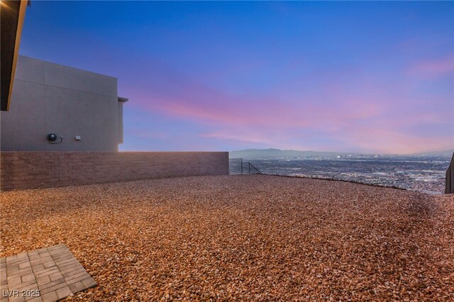 view of yard at dusk