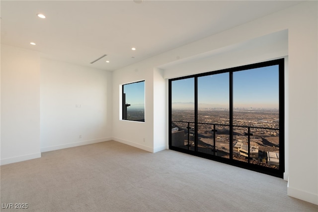 empty room with light colored carpet