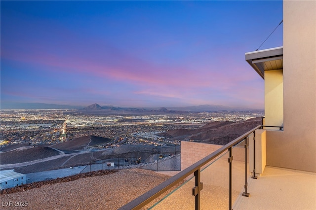 view of balcony at dusk