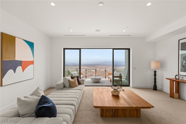 living area with recessed lighting, carpet, and baseboards