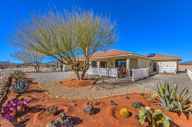 view of front of home featuring solar panels